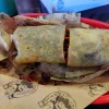 A flavorful burrito at Tijuanazo Hipodromo, showcasing a soft tortilla stuffed with seasoned meat and fillings.