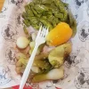 Grilled vegetables at Tijuanazo Hipodromo, featuring green peppers and onions.